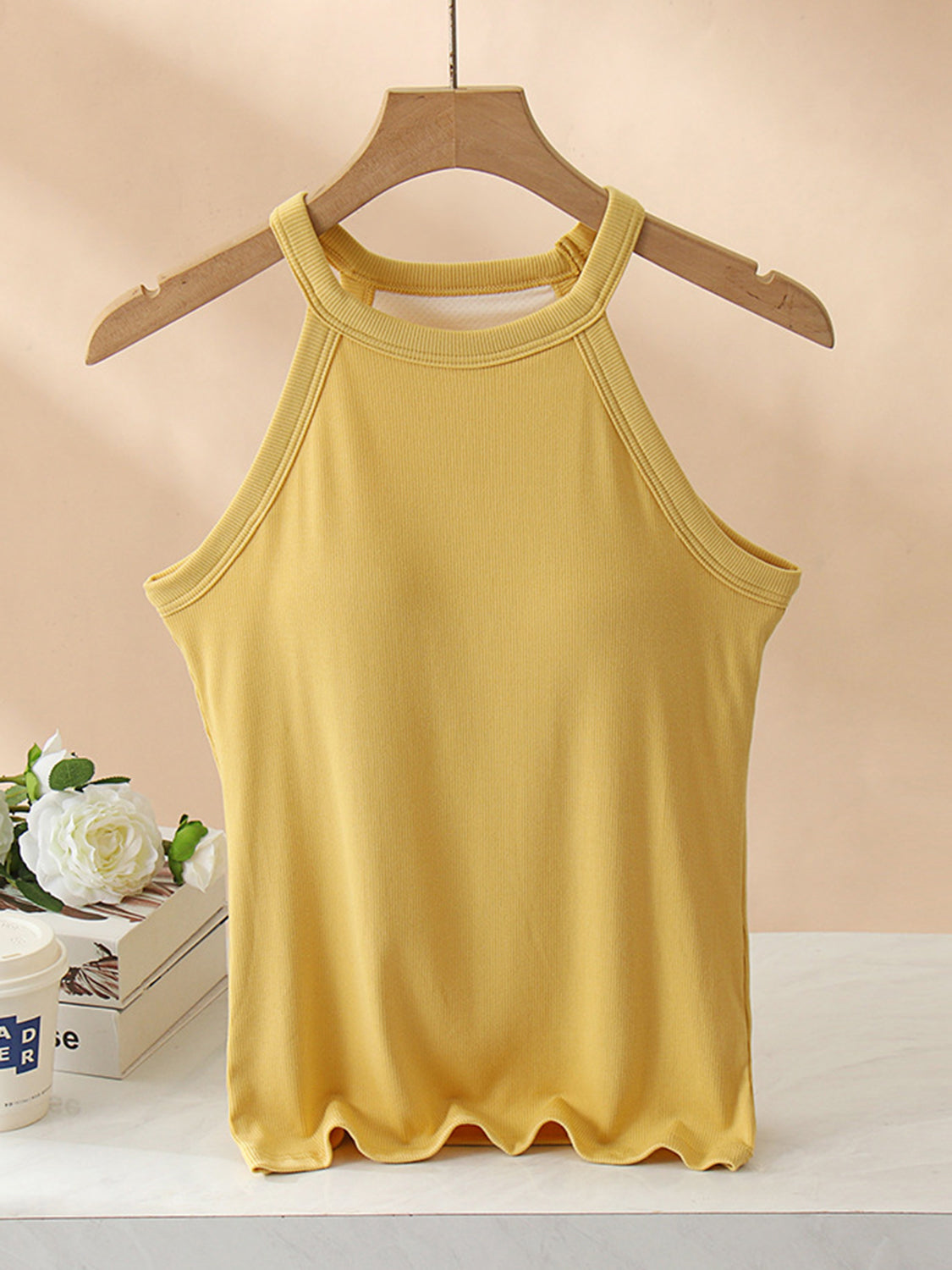 Grecian neck tank top with chest pads.