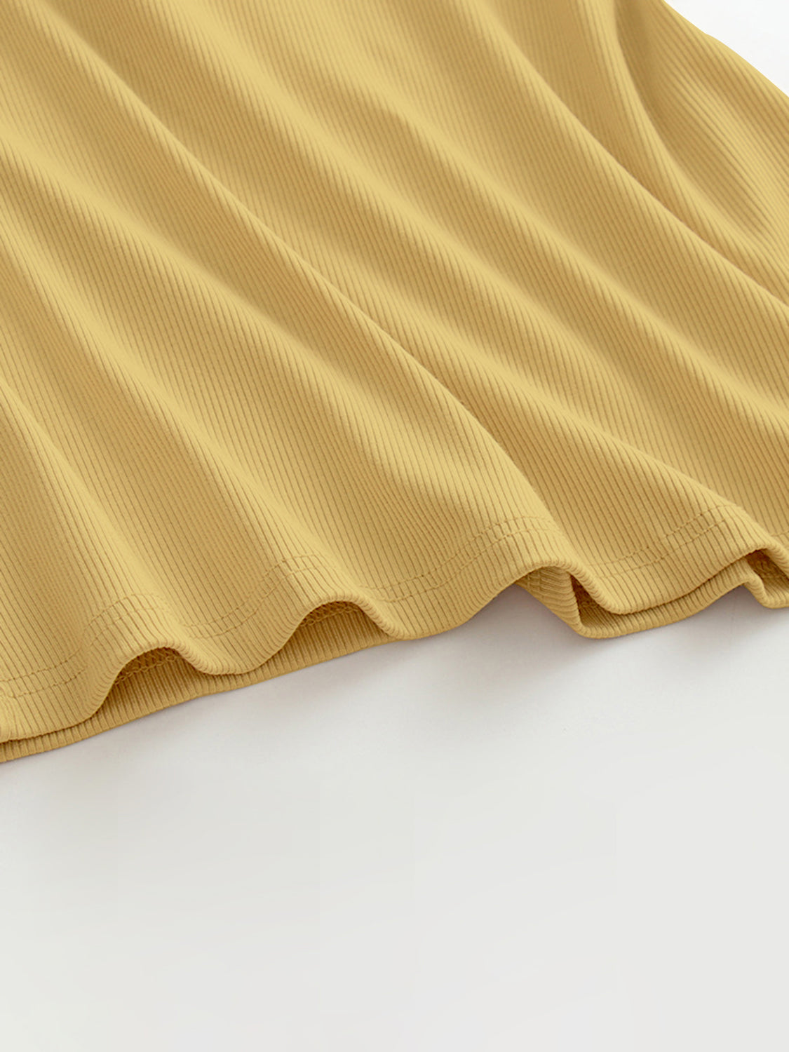 Grecian neck tank top with chest pads.