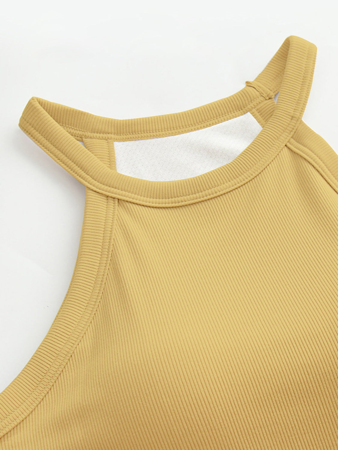 Grecian neck tank top with chest pads.