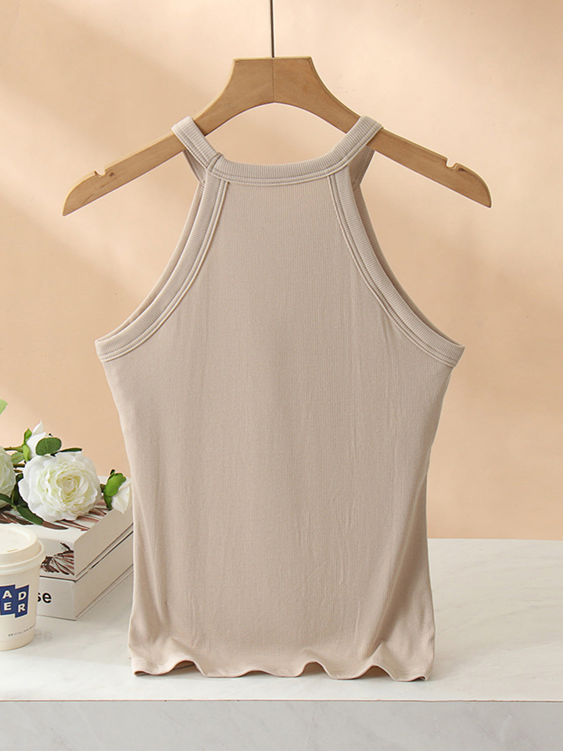 Grecian neck tank top with chest pads.