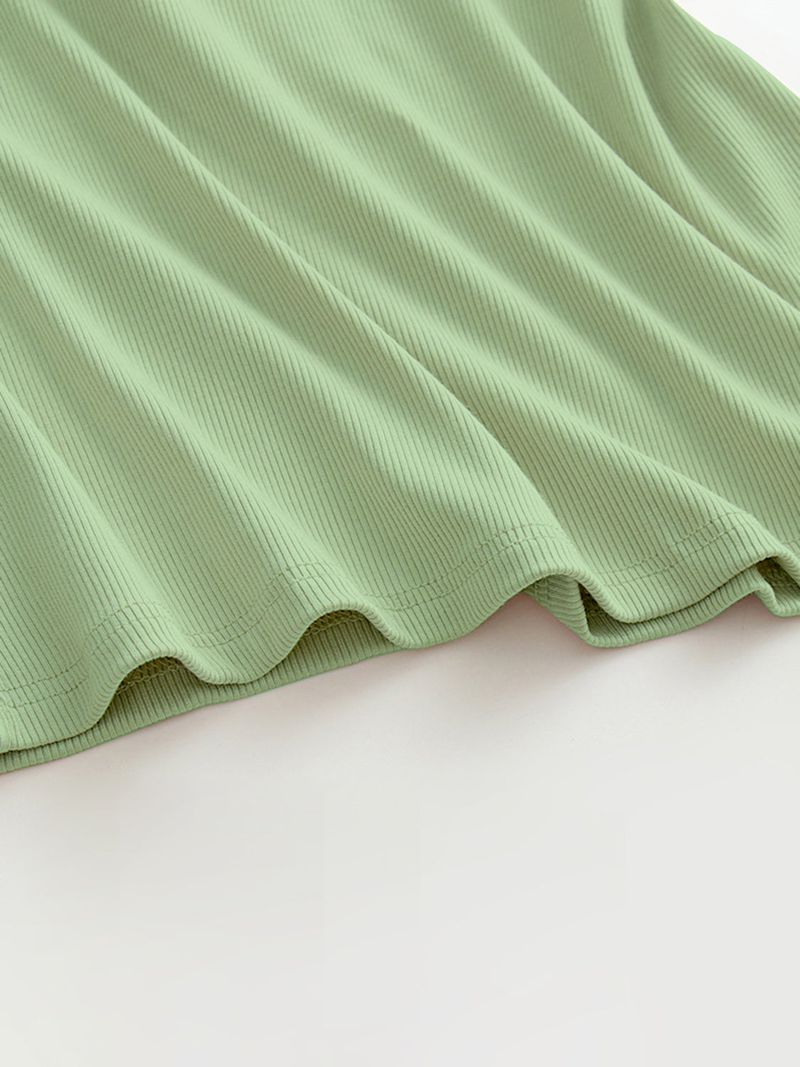 Grecian neck tank top with chest pads.
