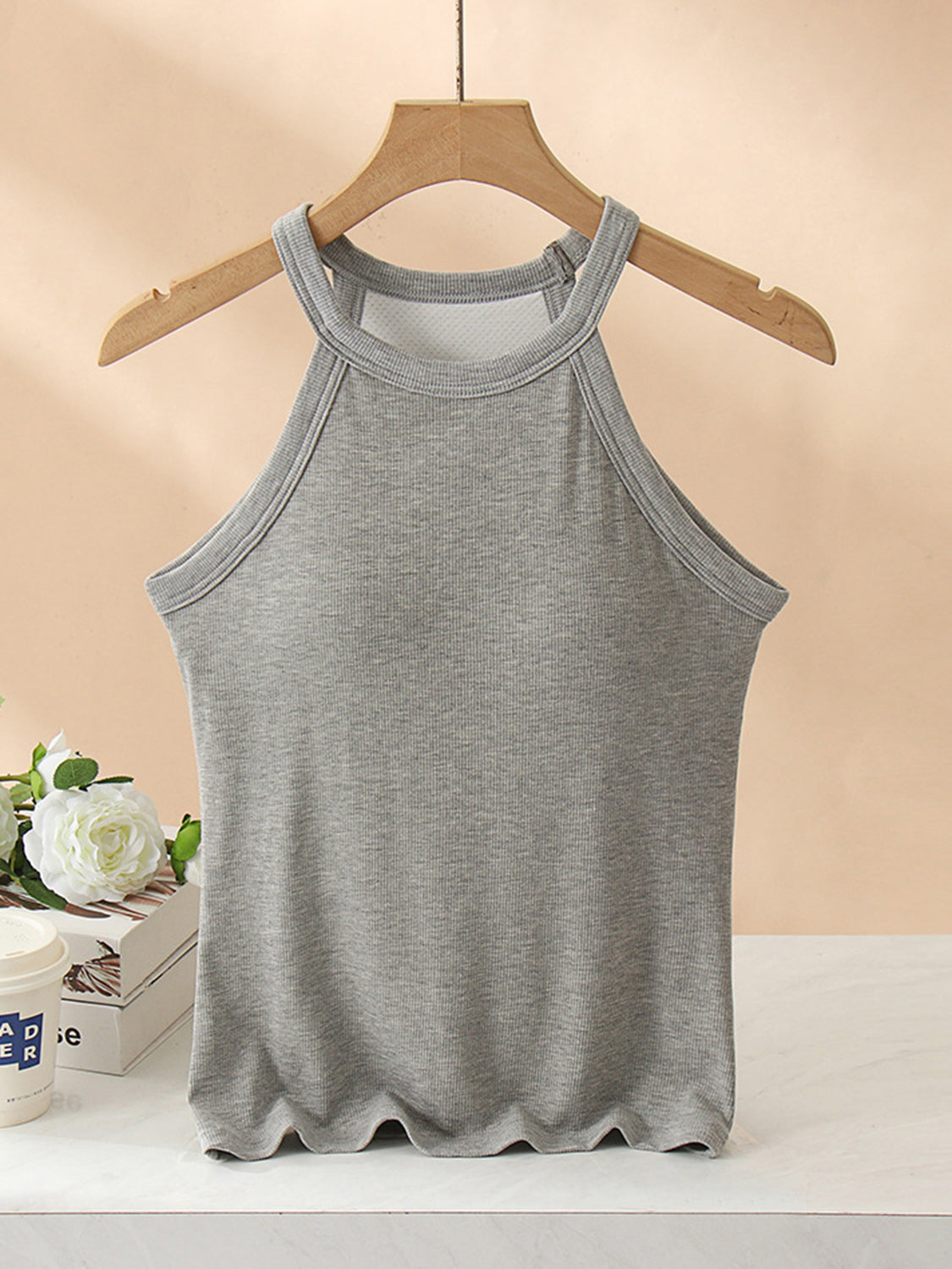 Grecian neck tank top with chest pads.