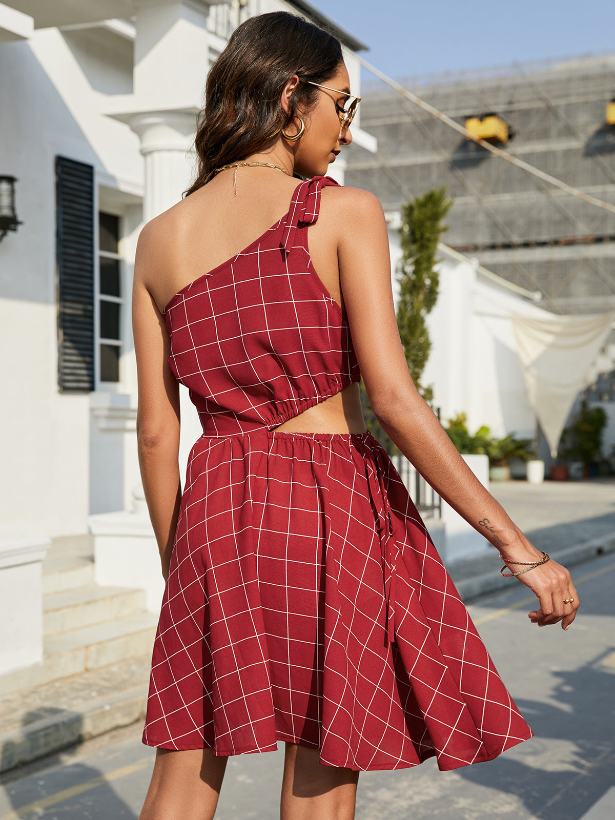Grid One-Shoulder Tied Cutout Mini Dress.