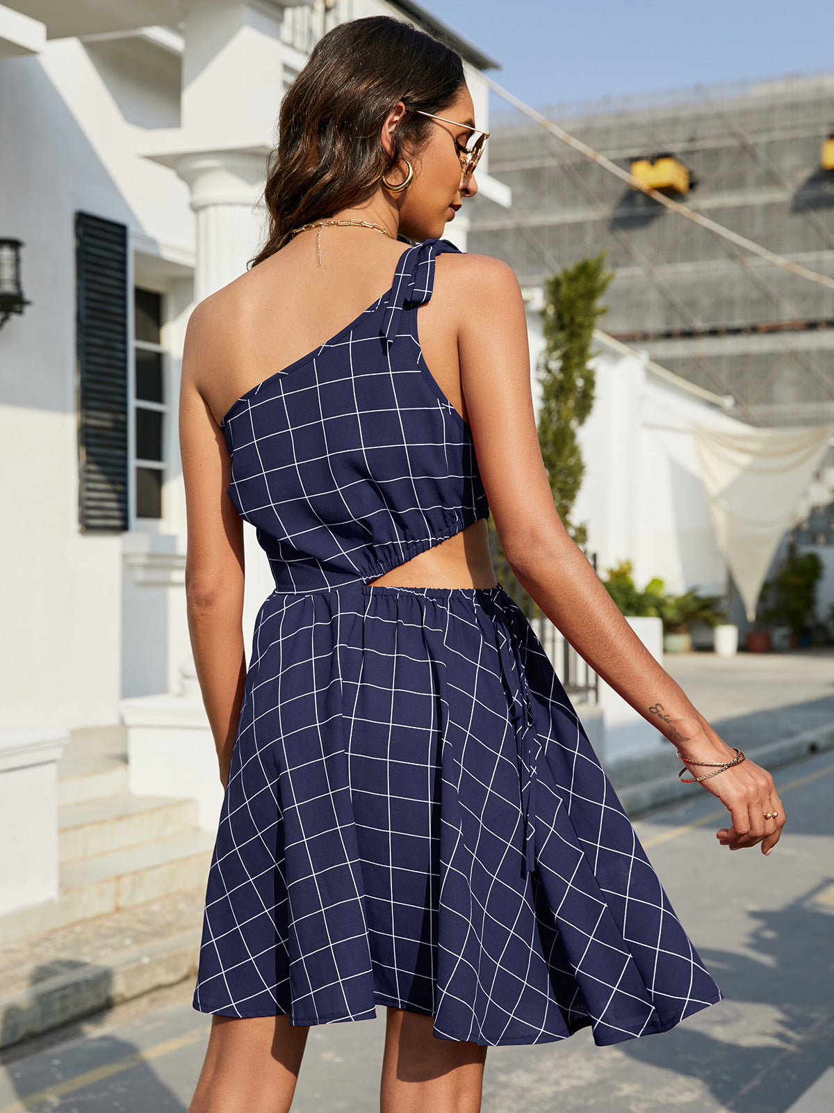 Grid One-Shoulder Tied Cutout Mini Dress.