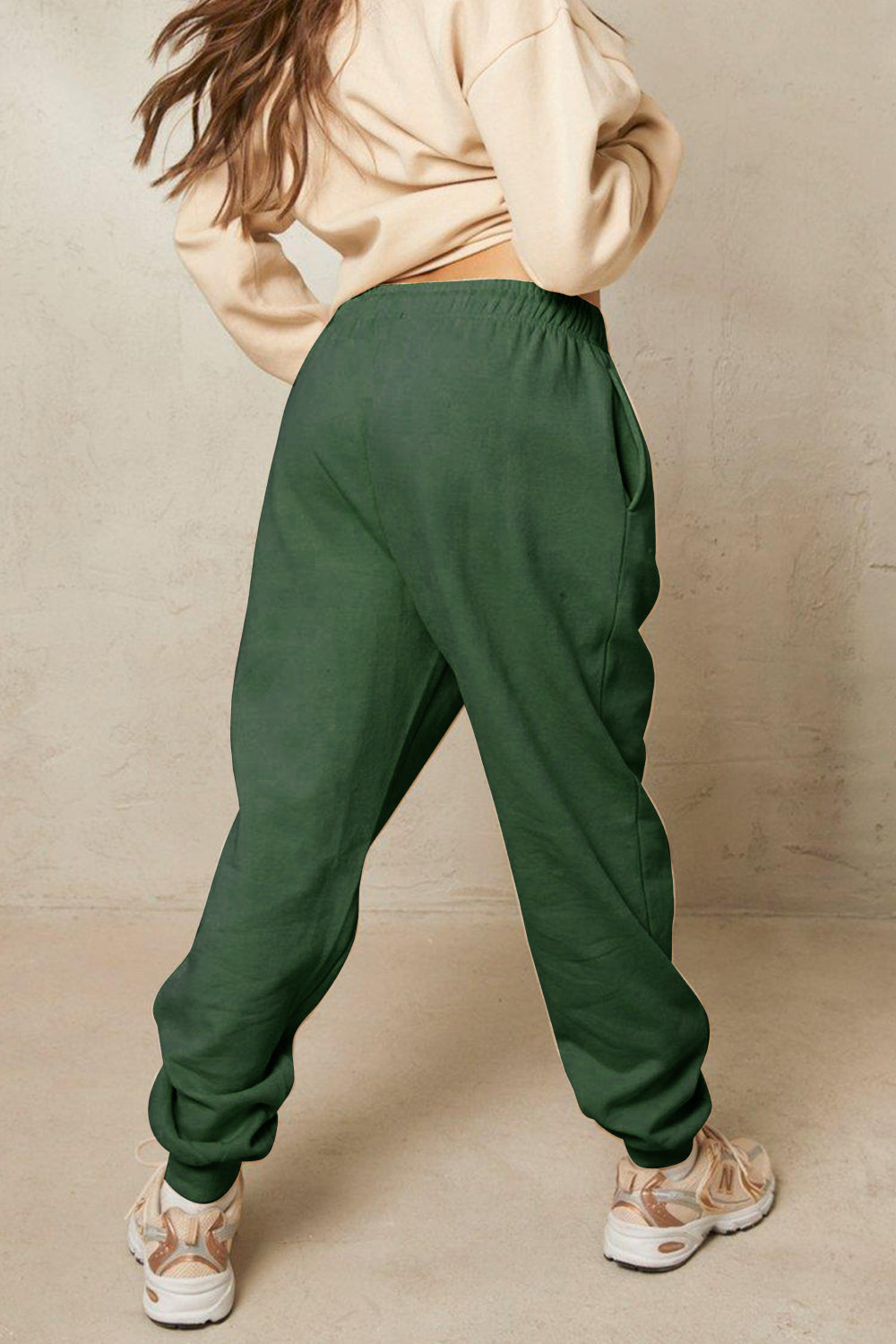 HAVE THE DAY YOU DESERVE graphic sweatpants with drawstring.