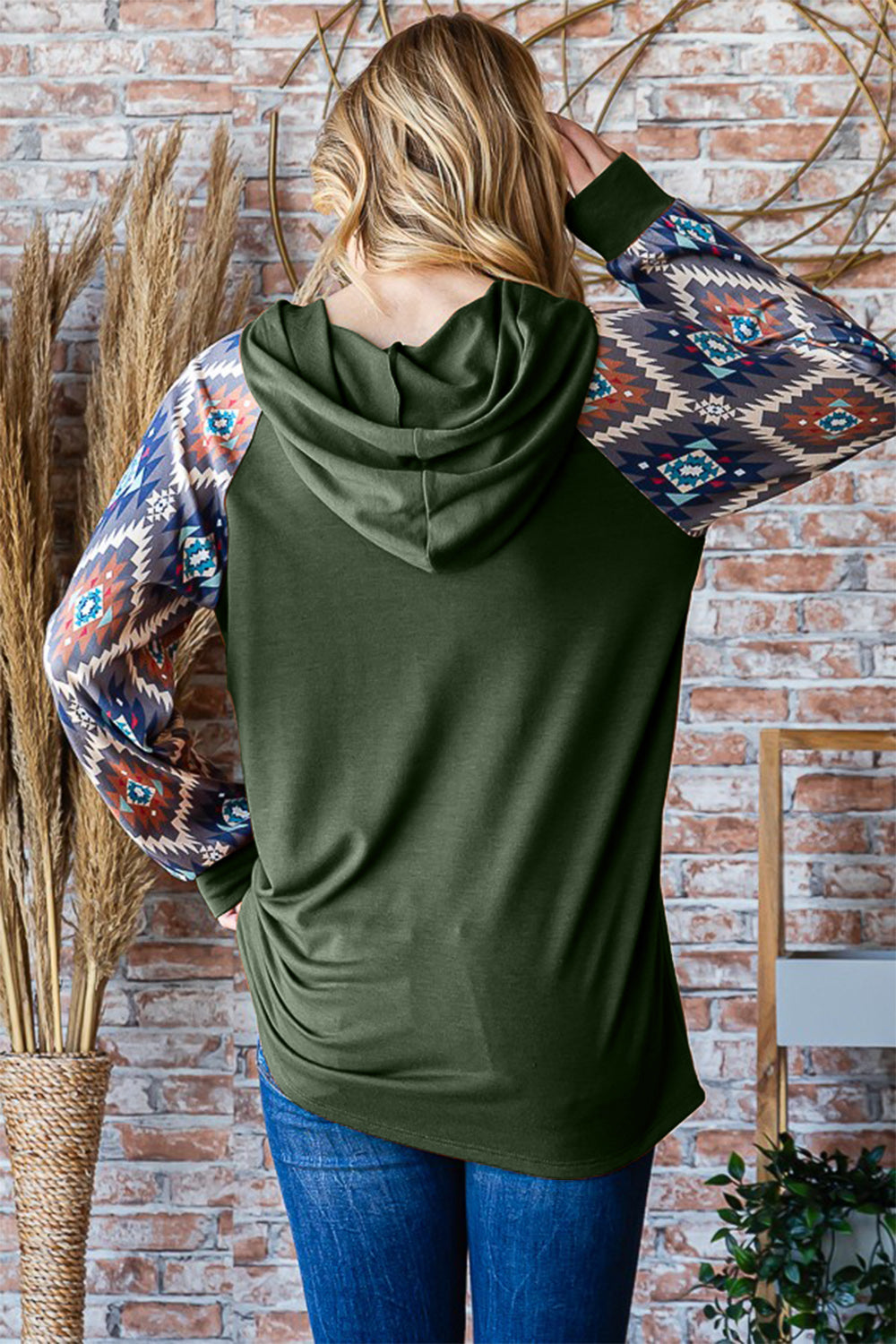 Full size half button printed long sleeve hooded top.