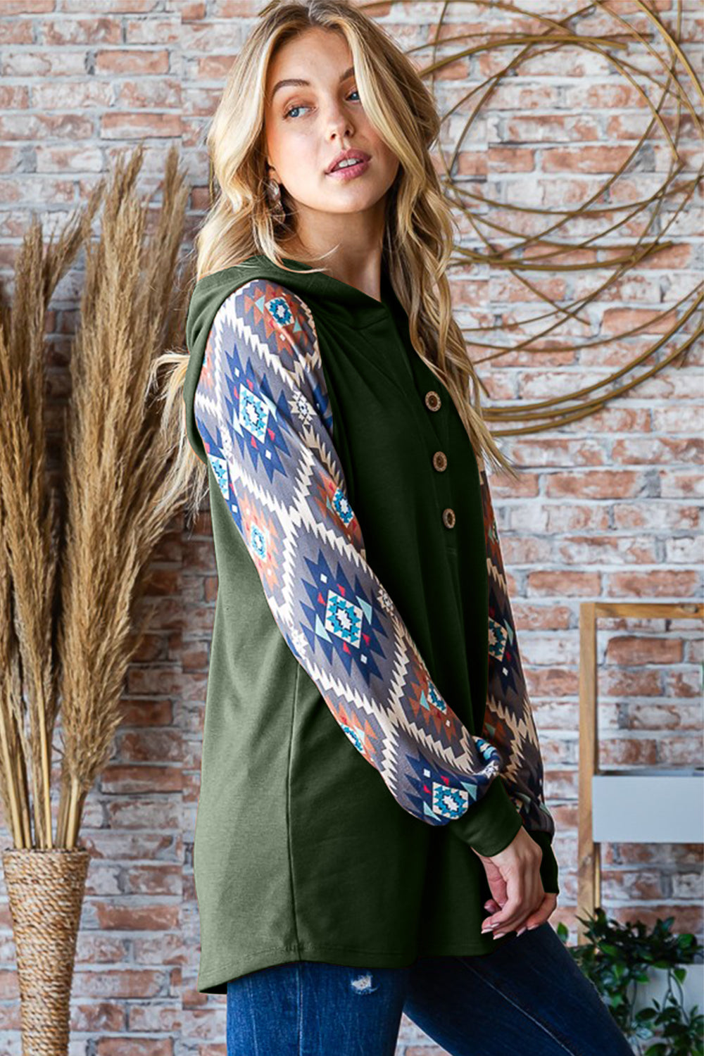 Full size half button printed long sleeve hooded top.