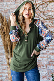 Full size half button printed long sleeve hooded top.