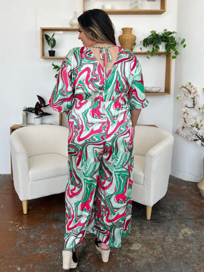 Half Sleeve Wide Leg Jumpsuit with Tie and Ruched Details.