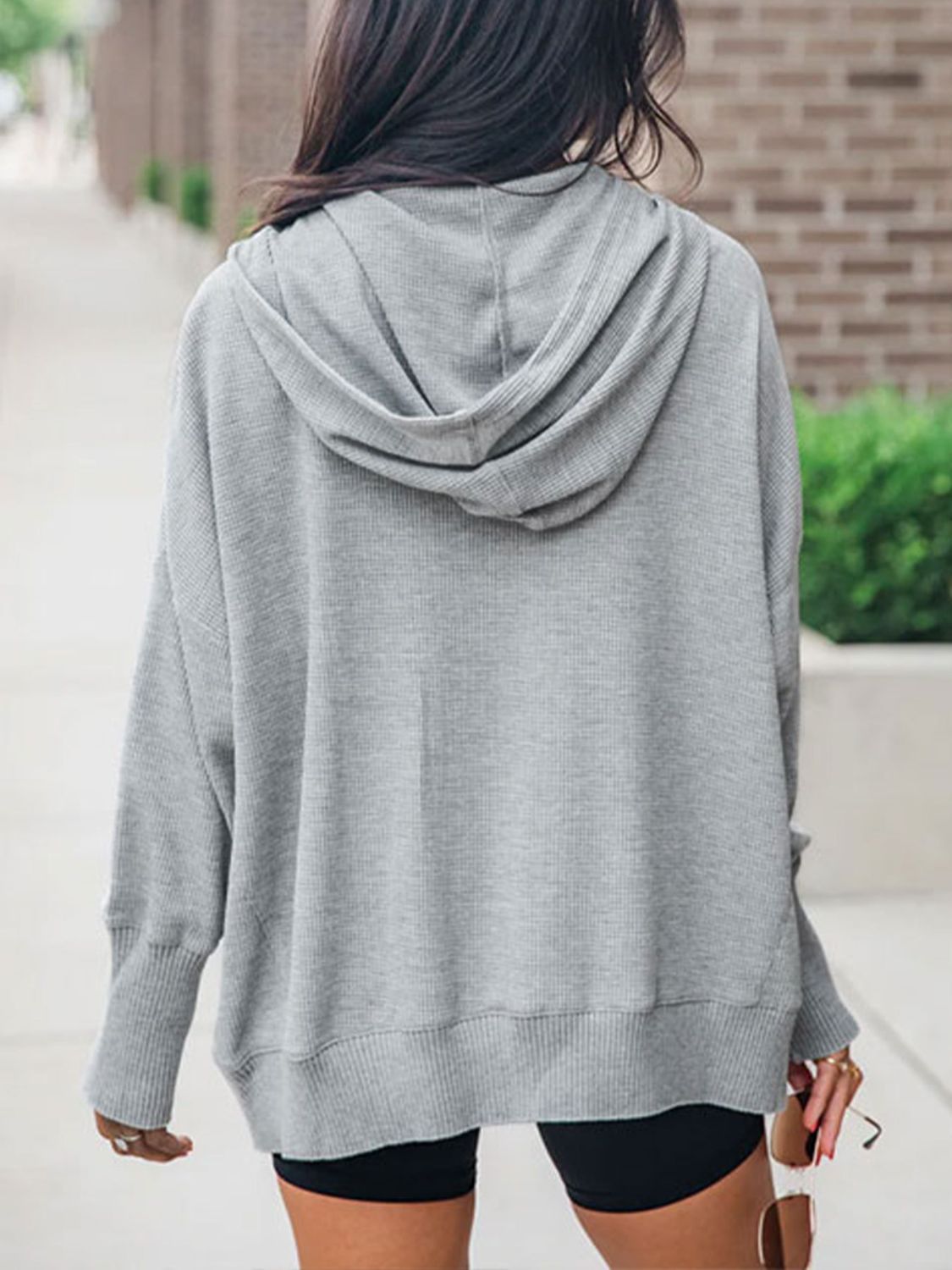 Half snap long sleeve hoodie with pockets.