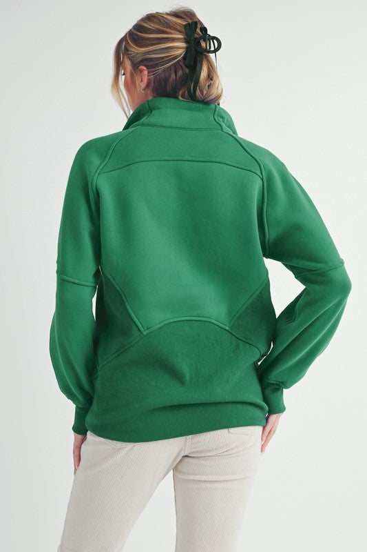 Half zip raglan sleeve sweatshirt with kangaroo pocket.