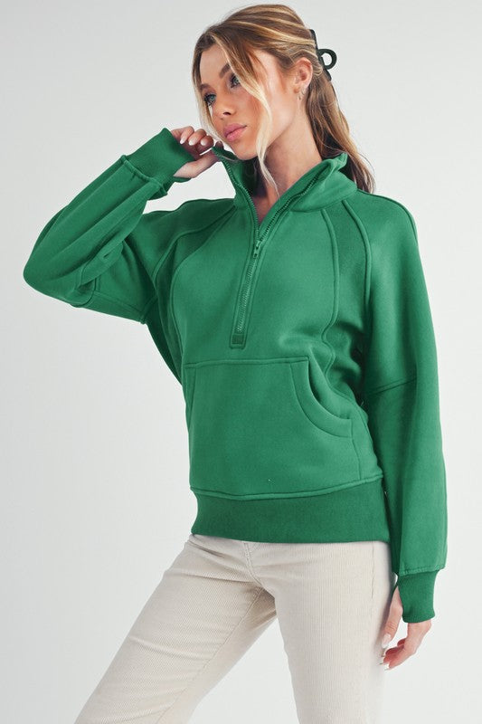 Half zip raglan sleeve sweatshirt with kangaroo pocket.