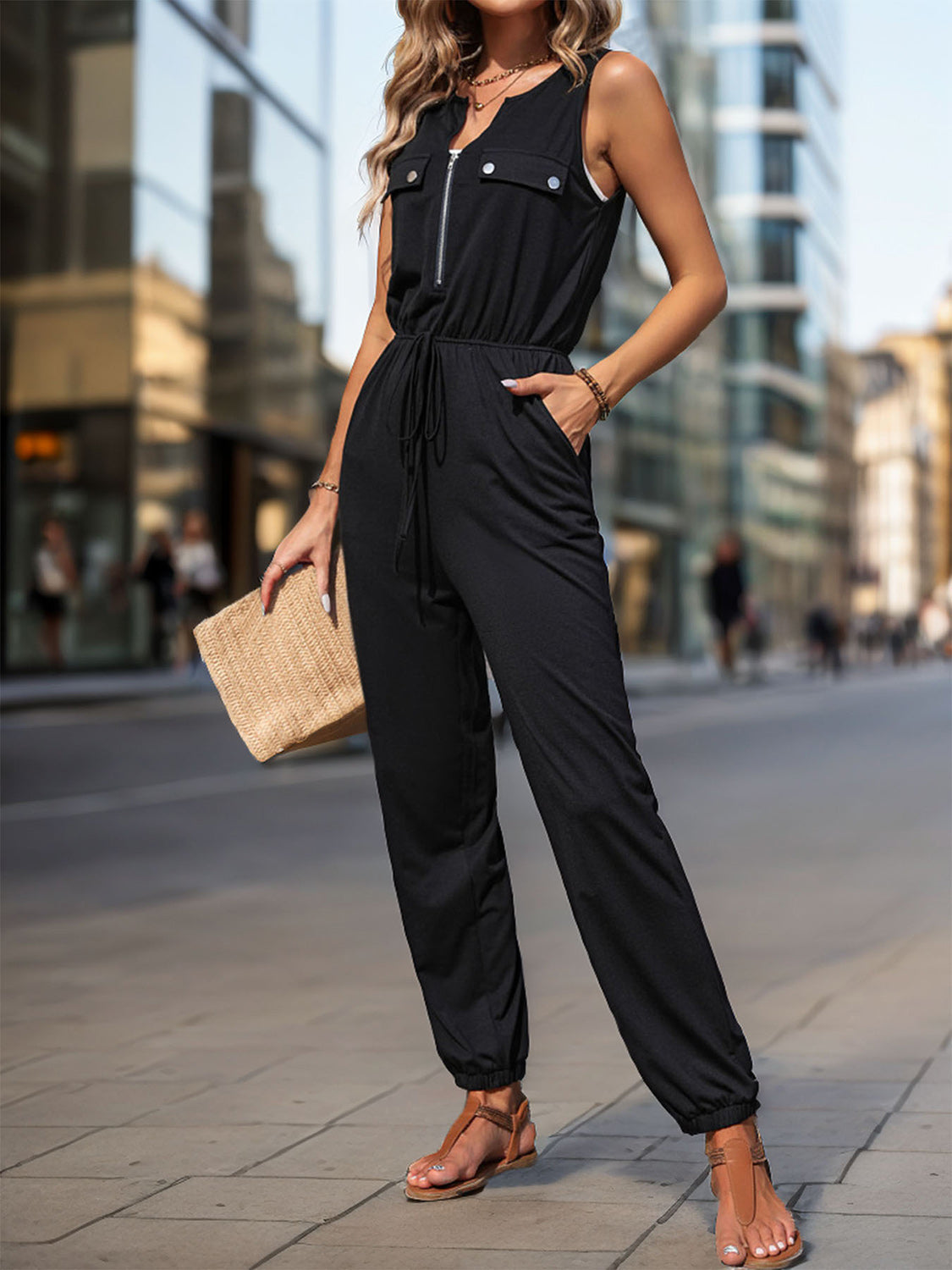 Half Zip Sleeveless Jumpsuit with Pockets and Tie.