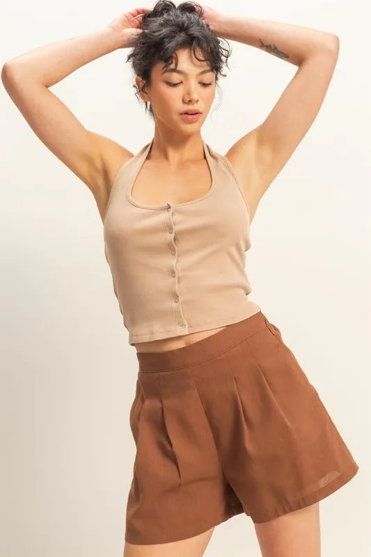 Halter neck buttoned washed top with ribbed texture, moderately stretchy.