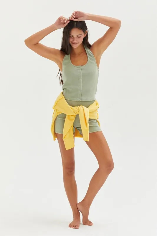 Halter neck buttoned washed top with ribbed texture, moderately stretchy.