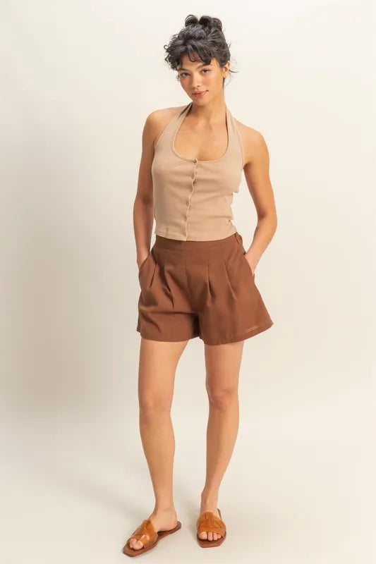 Halter neck buttoned washed top with ribbed texture, moderately stretchy.