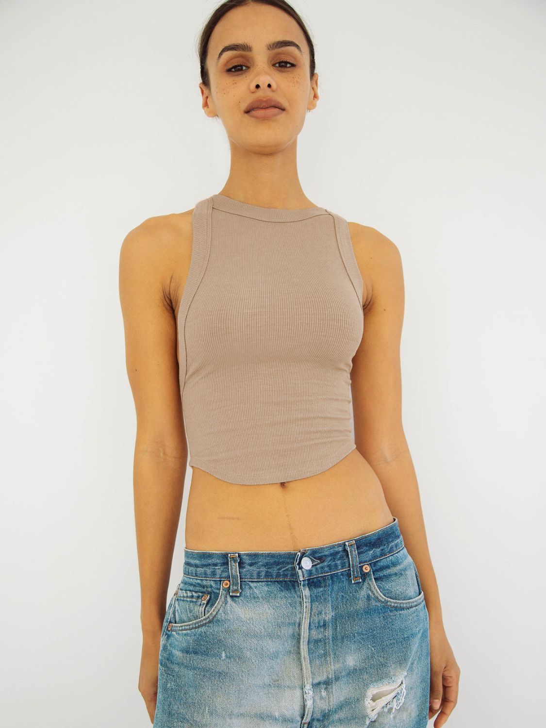 Halter neck ribbed cropped top with backless design.