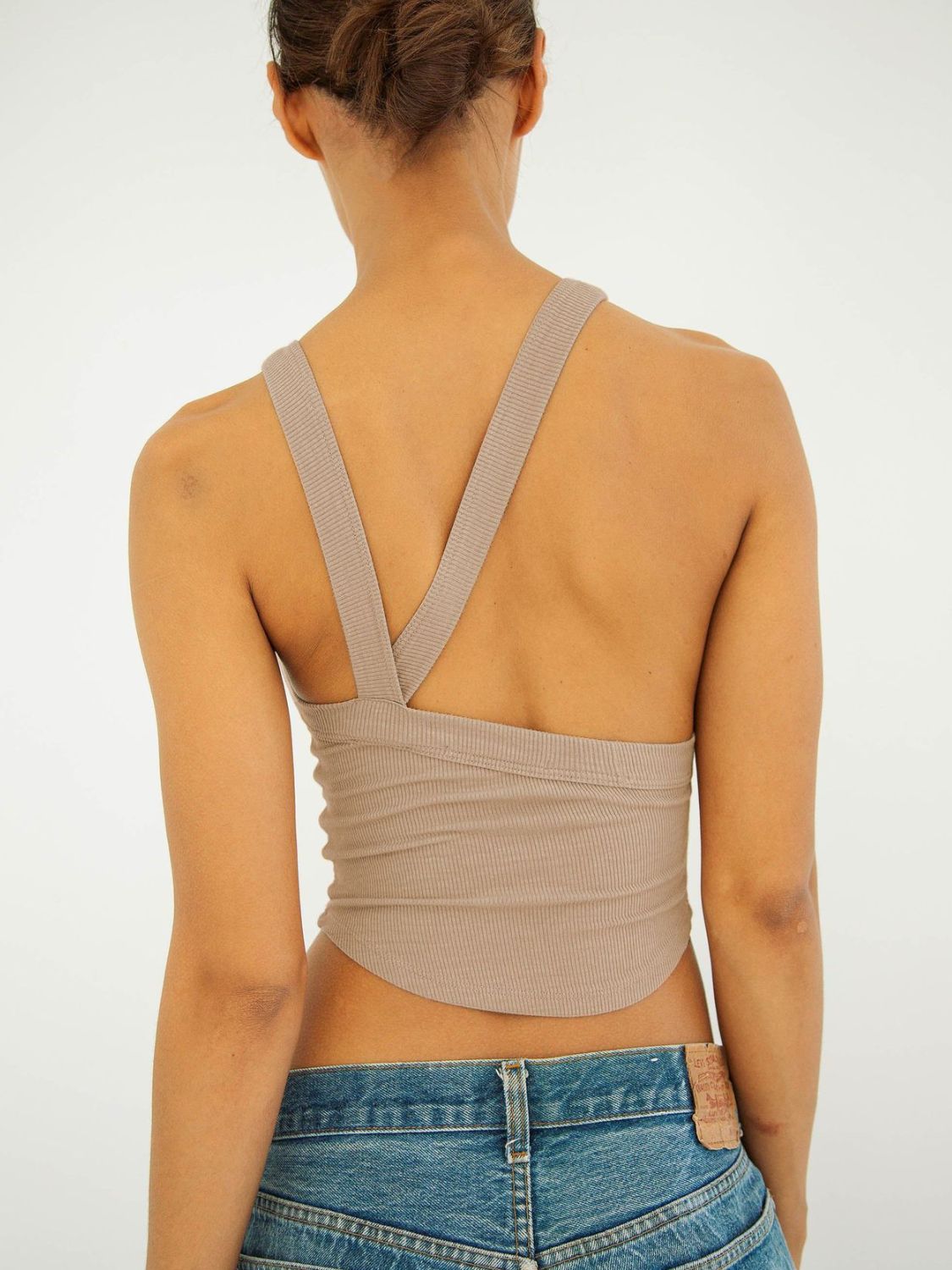 Halter neck ribbed cropped top with backless design.
