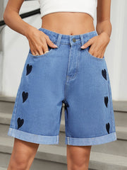 Heart-pattern rolled hem denim shorts with pockets.