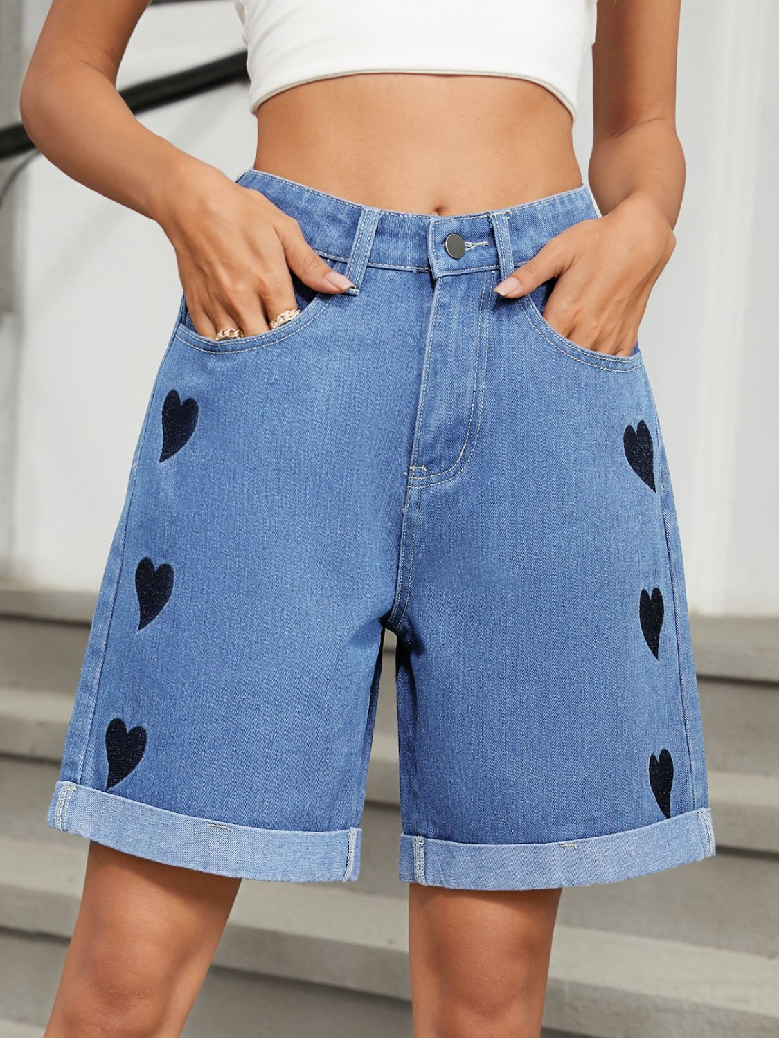 Heart-pattern rolled hem denim shorts with pockets.