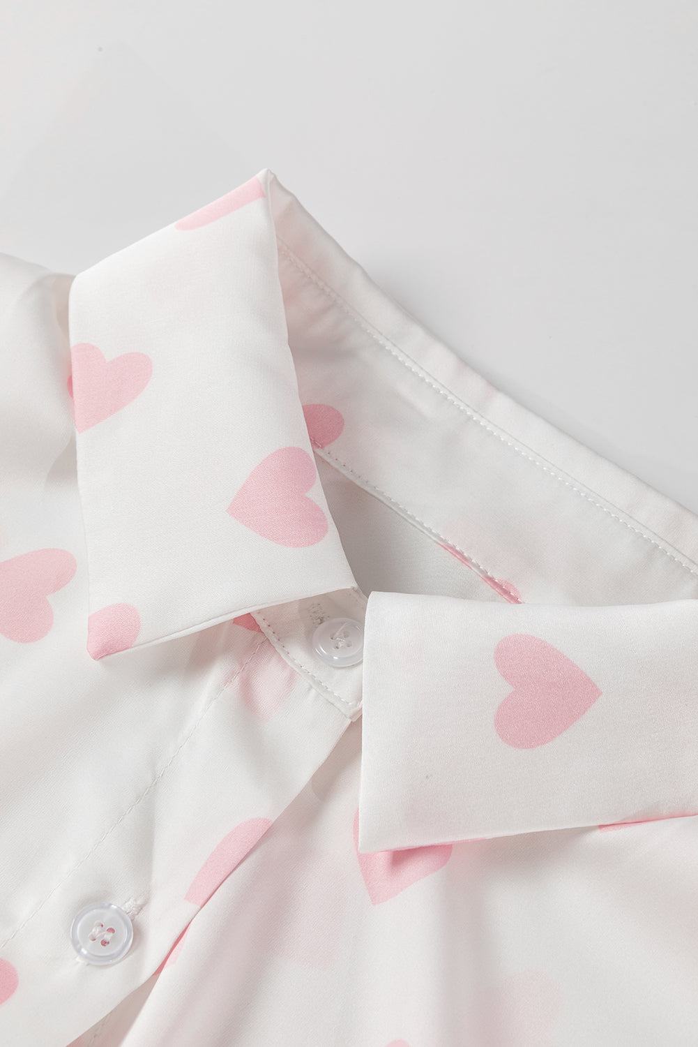 Heart print collared neck long sleeve shirt.