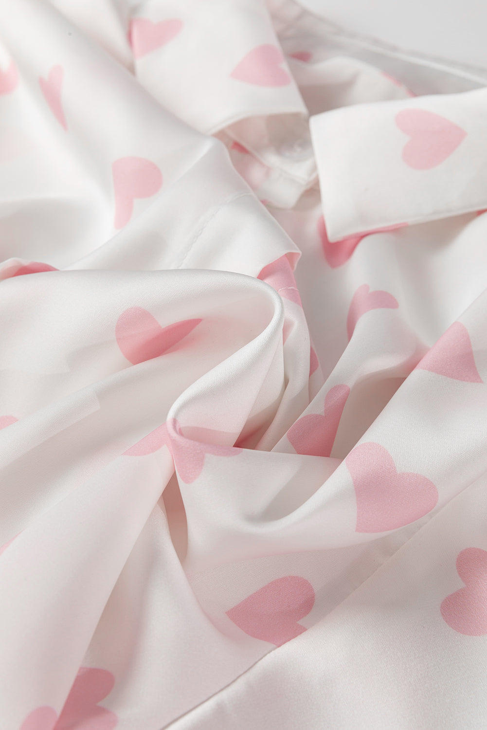 Heart print collared neck long sleeve shirt.