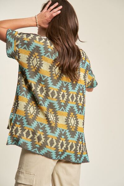 Davi Dani high-low geometric round neck knit top.