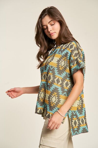 Davi Dani high-low geometric round neck knit top.
