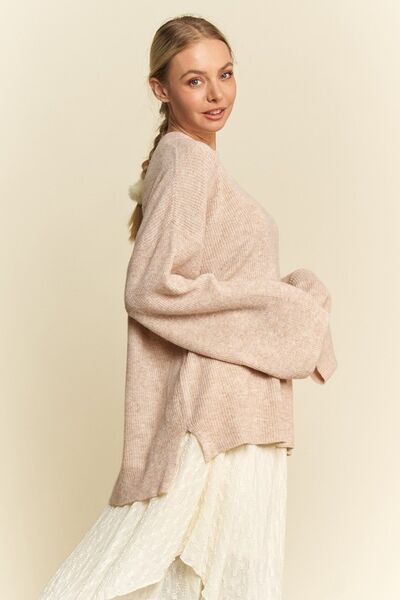 Davi Dani high-low round neck drop shoulder sweater.