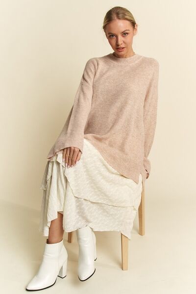 Davi Dani high-low round neck drop shoulder sweater.