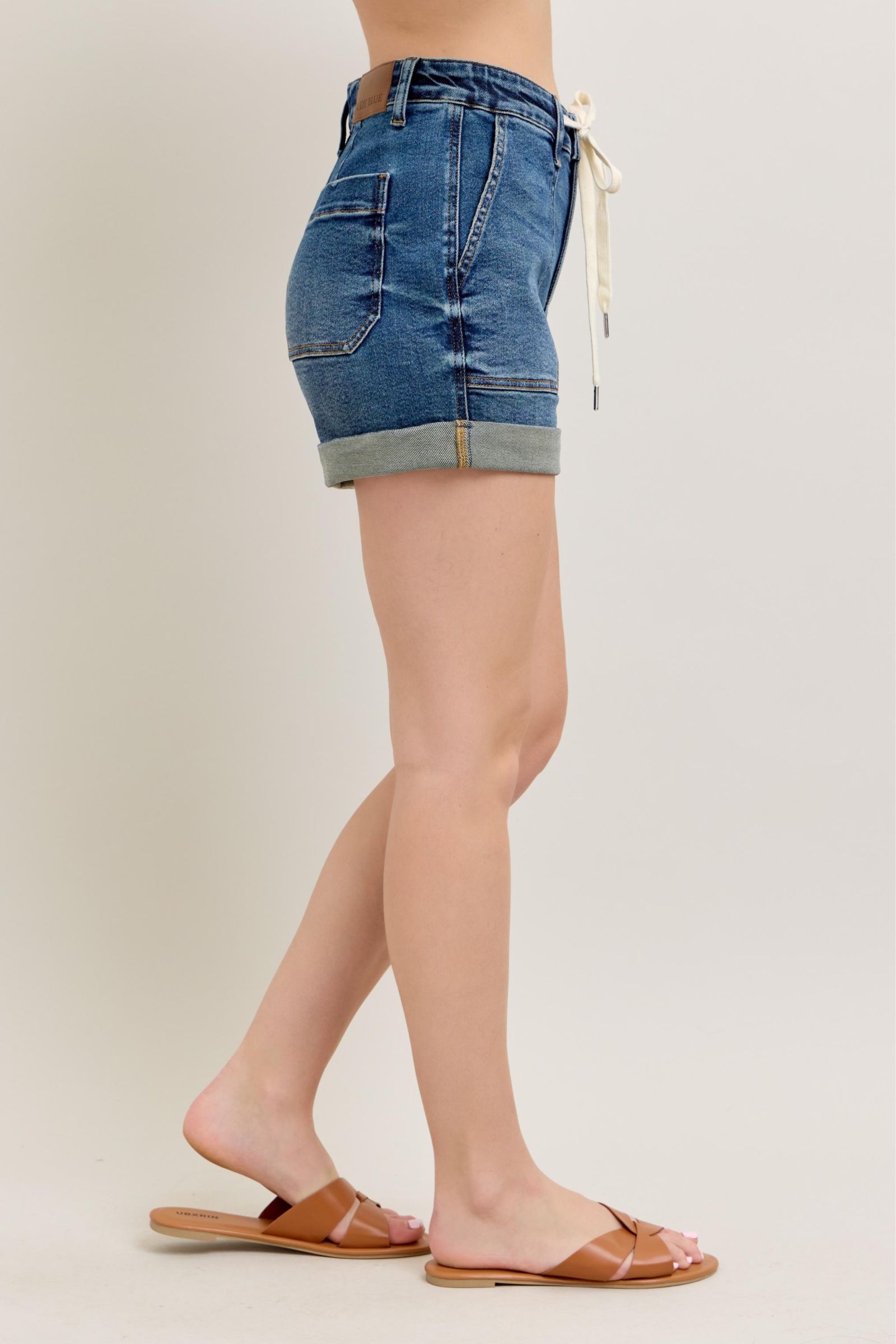 Plus size high rise cuff denim shorts with pockets.