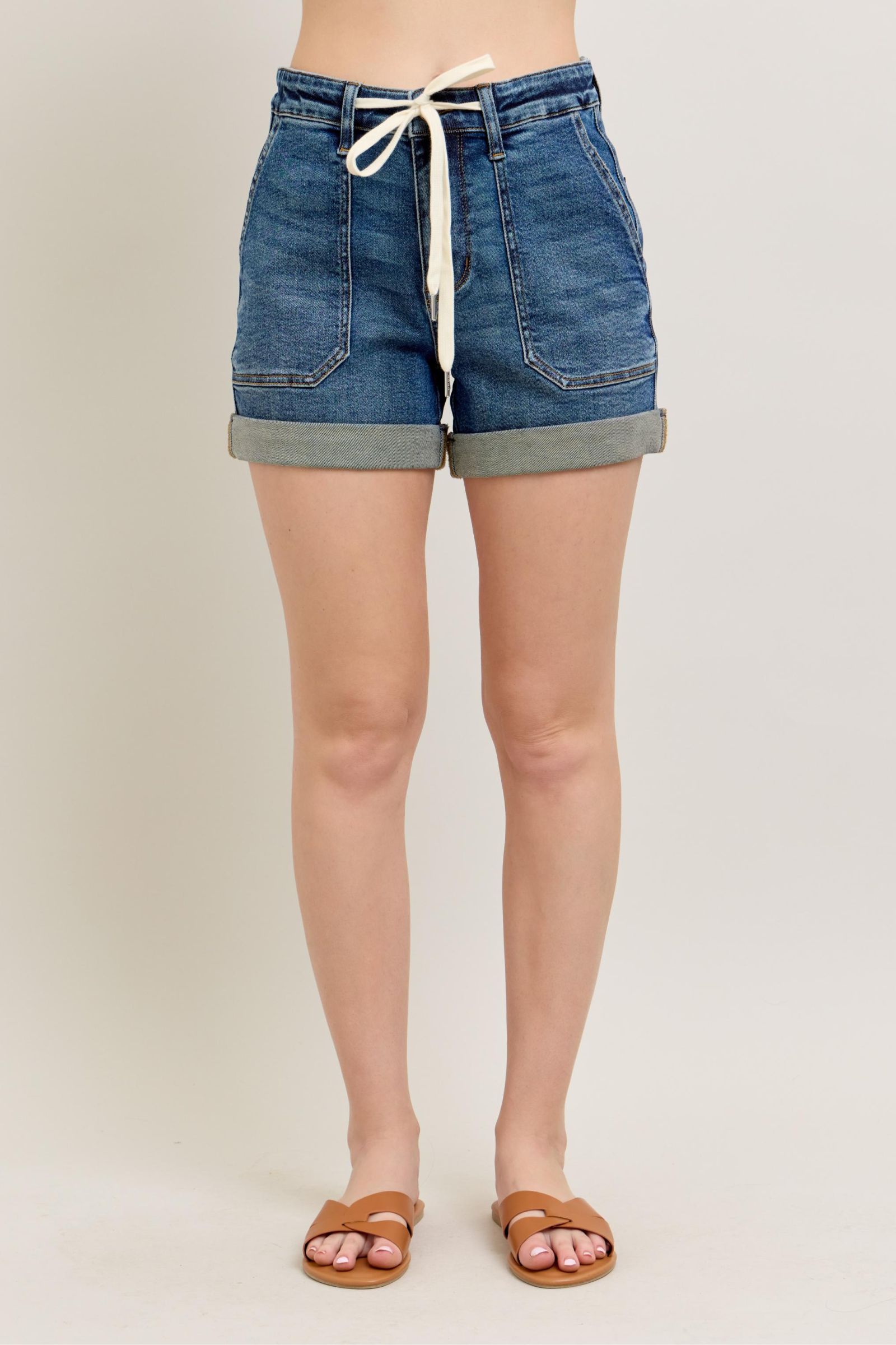 Plus size high rise cuff denim shorts with pockets.