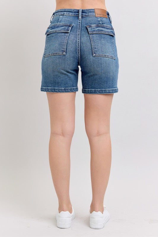 Plus size high rise denim shorts with pockets.