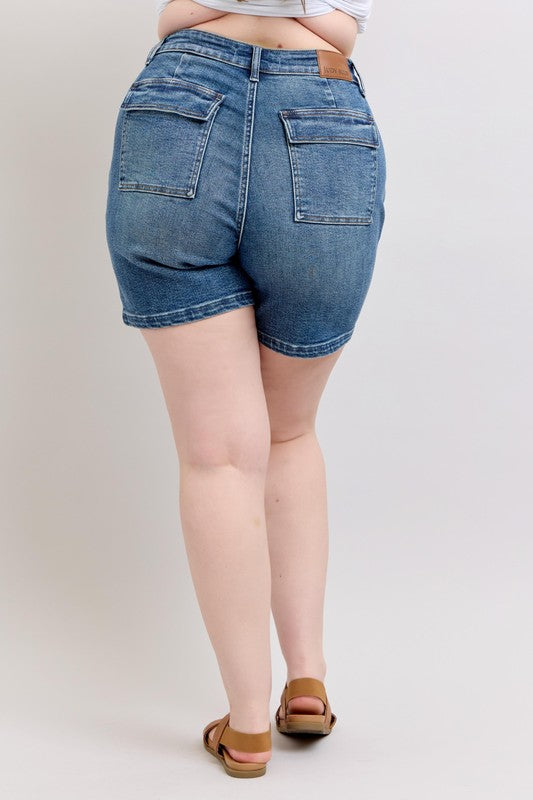 Plus size high rise denim shorts with pockets.