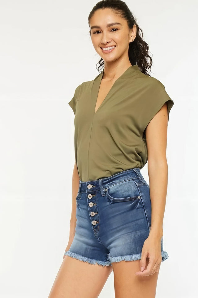 High rise frayed hem denim shorts with pockets.