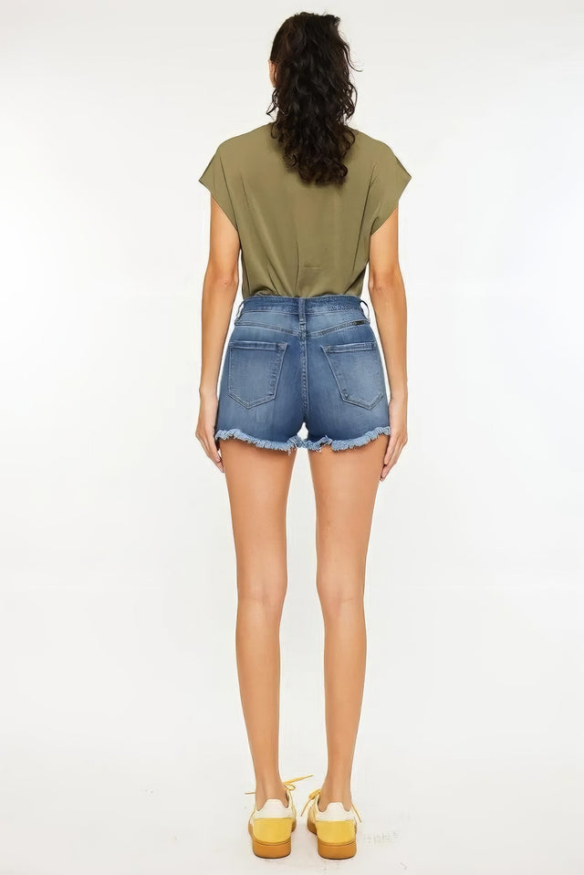 High rise frayed hem denim shorts with pockets.