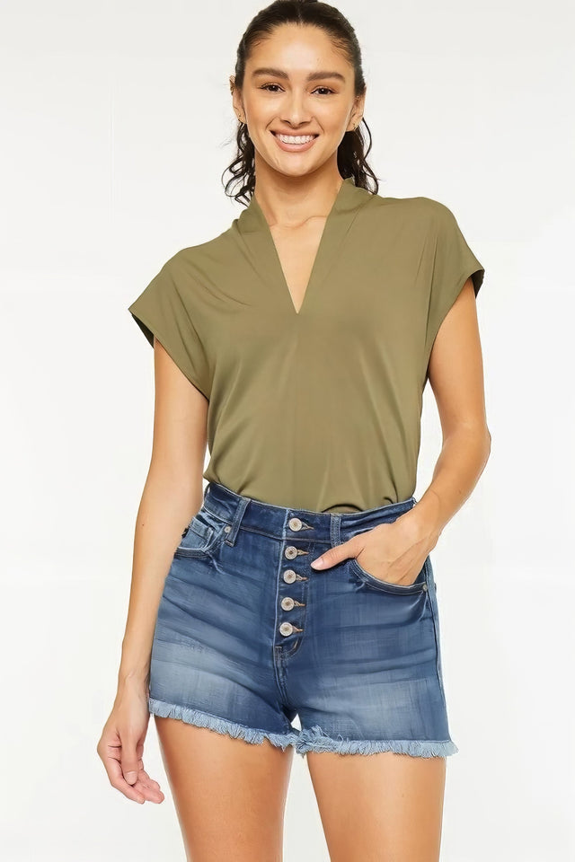 High rise frayed hem denim shorts with pockets.