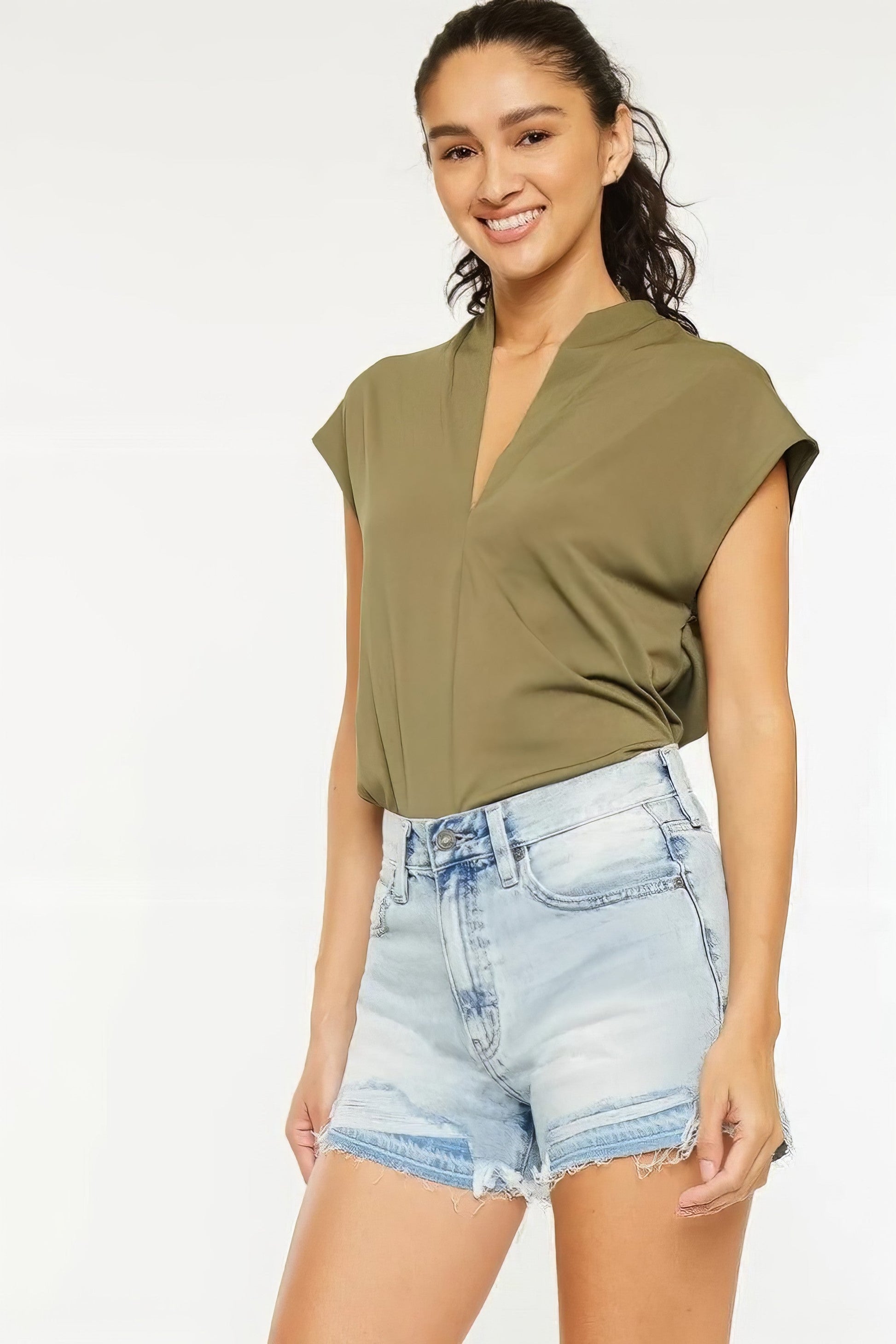 High rise raw hem denim shorts with pockets.