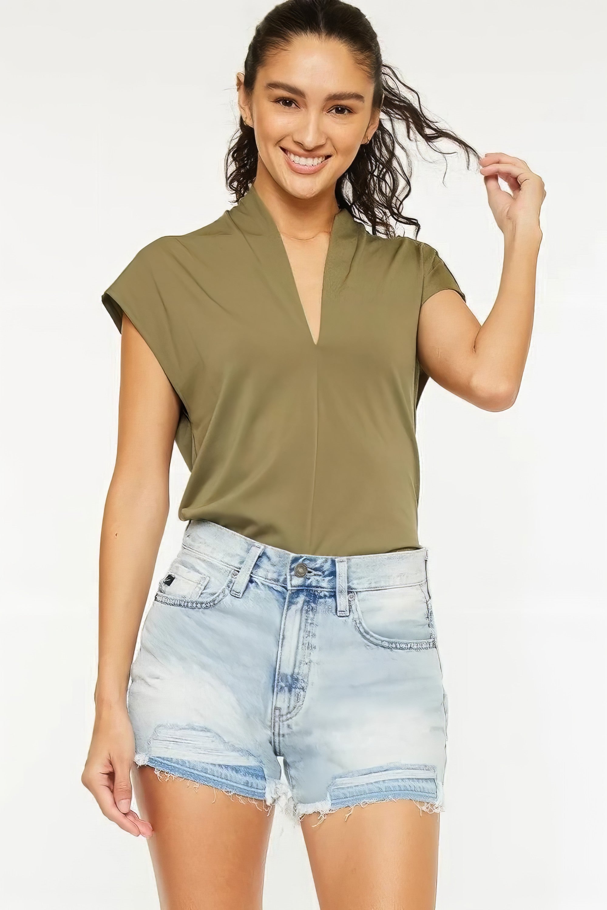 High rise raw hem denim shorts with pockets.