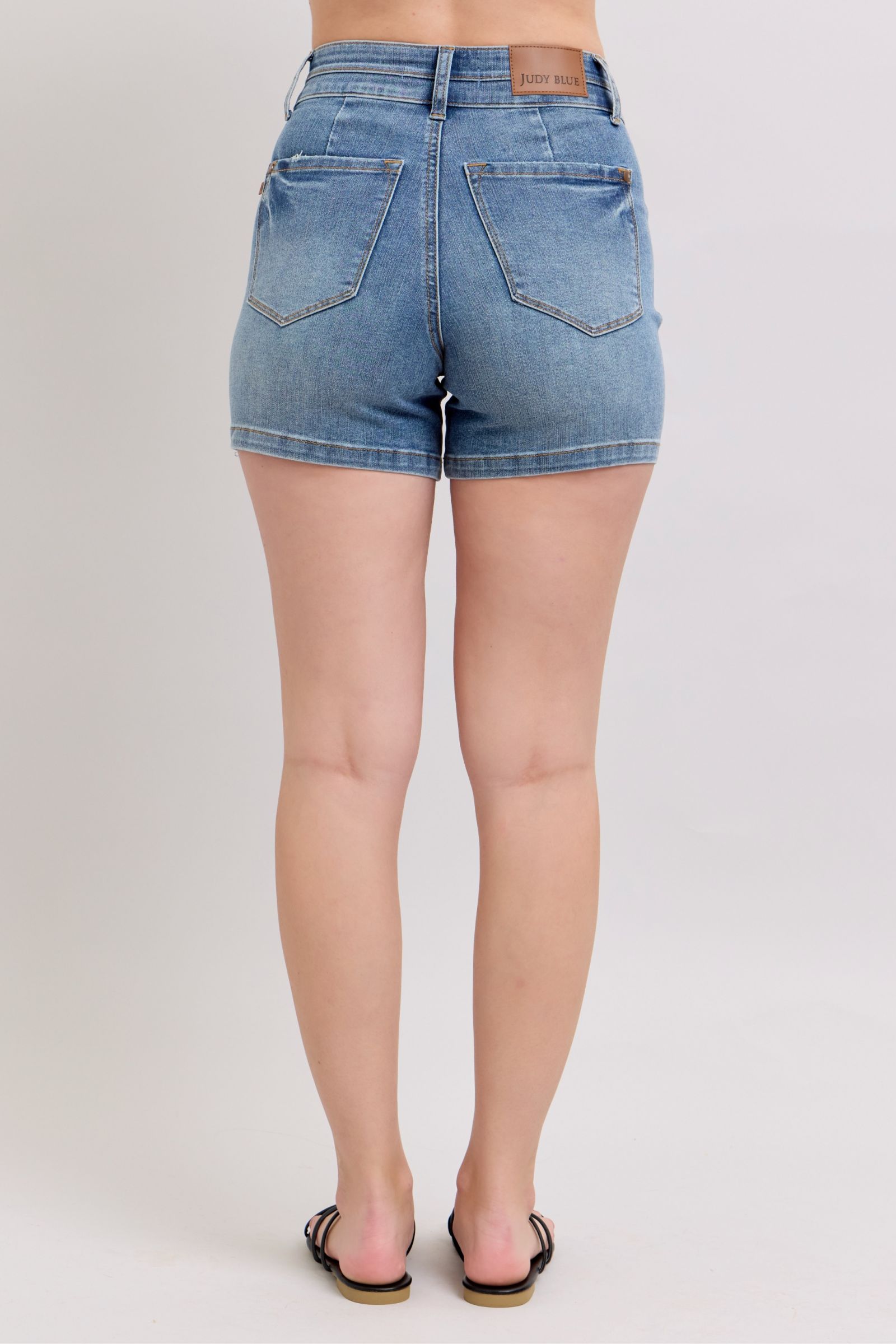 Plus size high rise tummy control denim shorts with pockets.