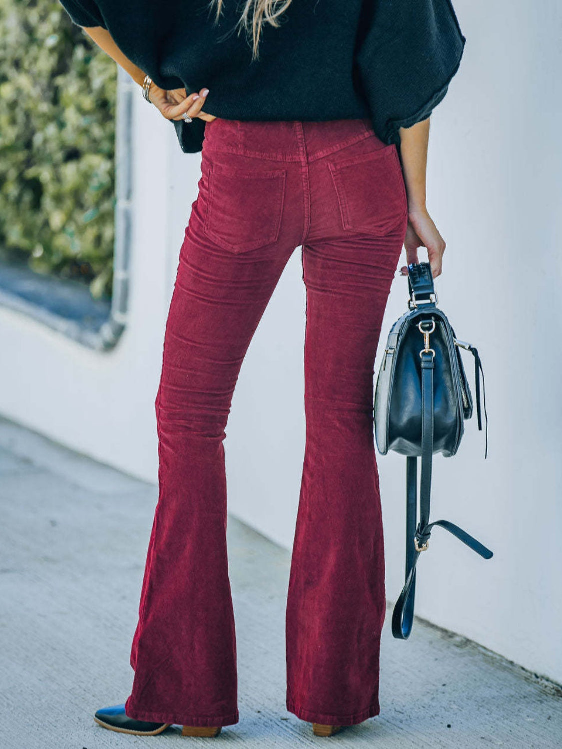 High waist bootcut pants, opaque.
