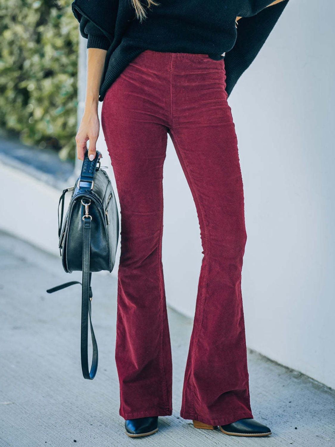 High waist bootcut pants, opaque.