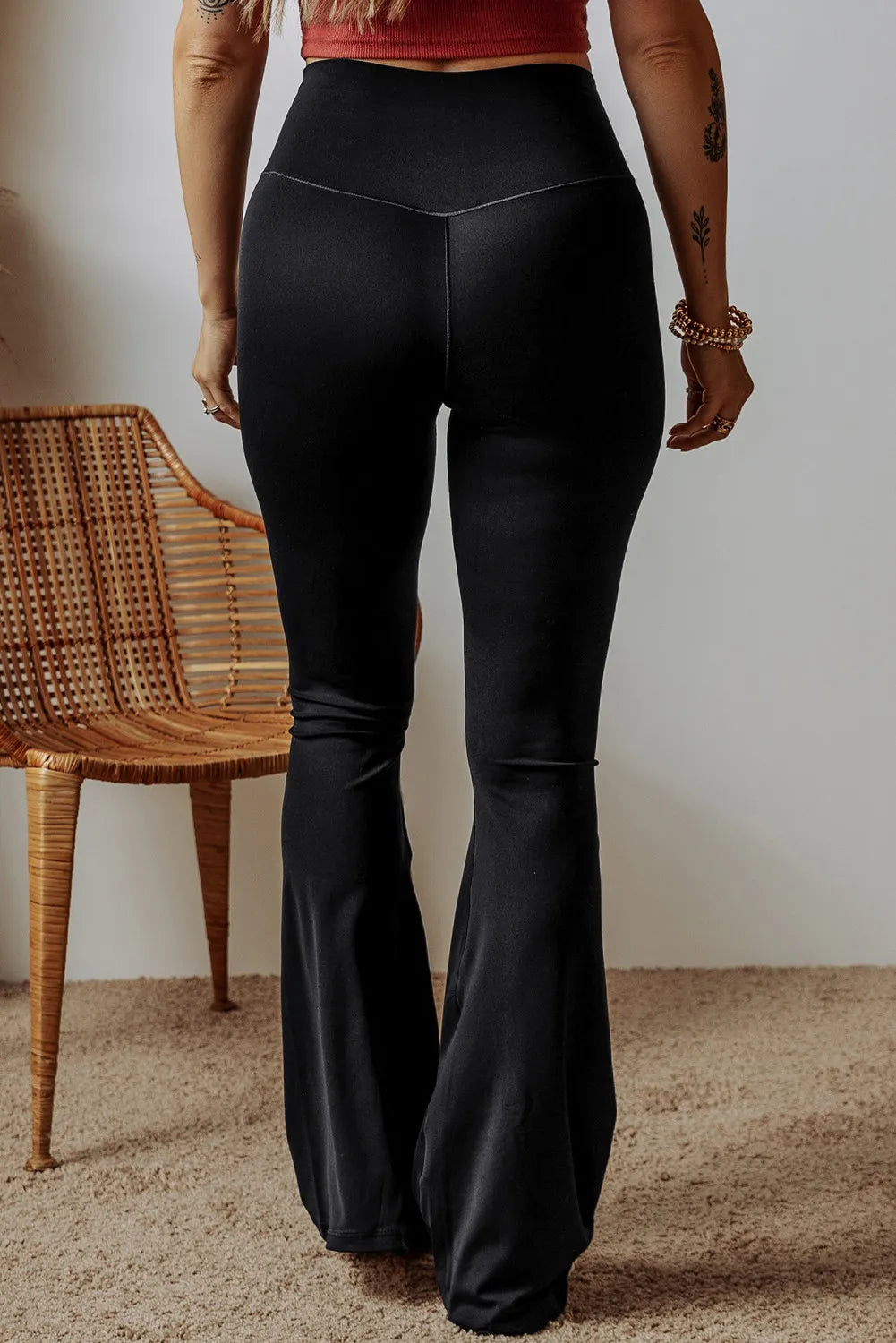High waist bootcut pants, opaque.