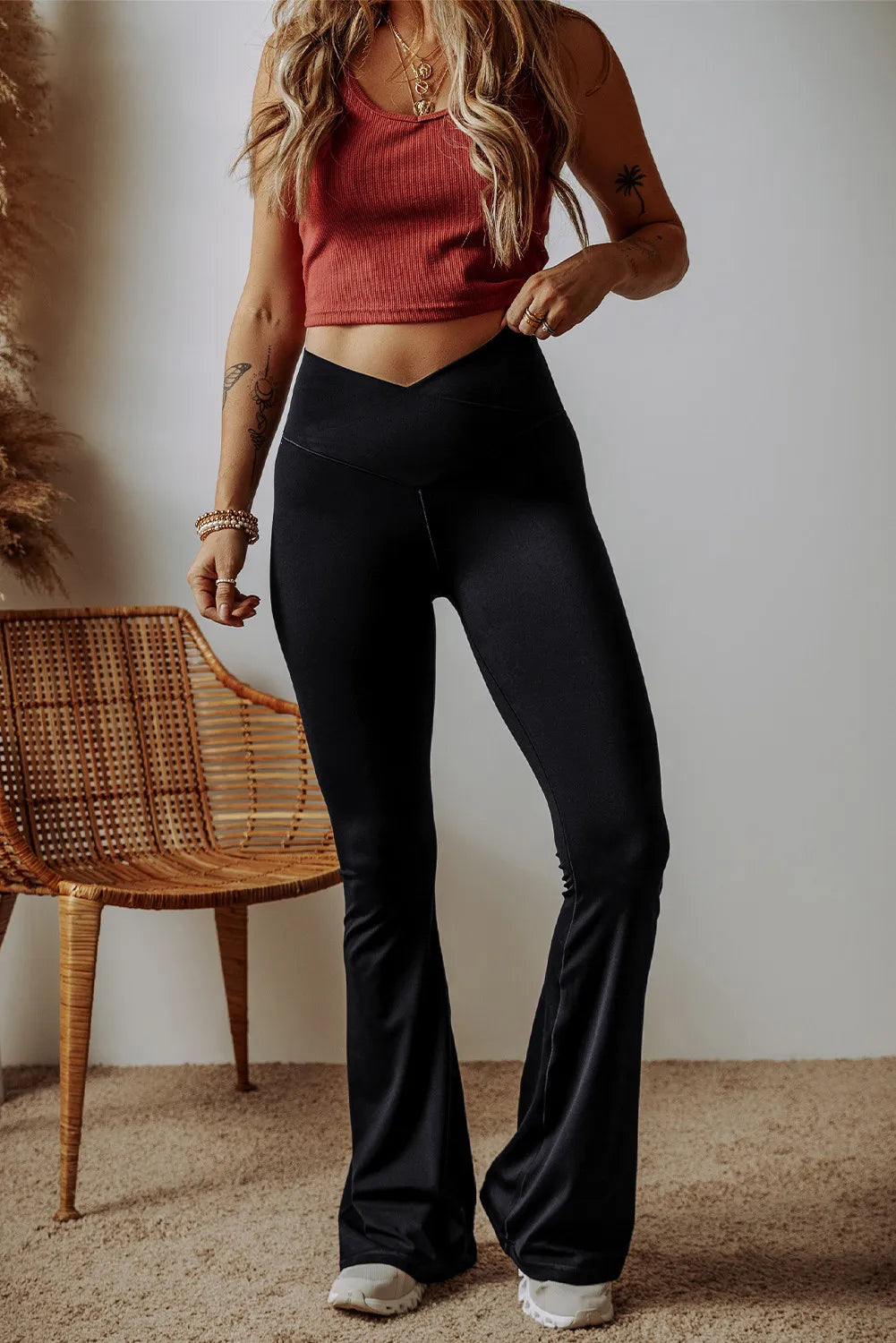 High waist bootcut pants, opaque.