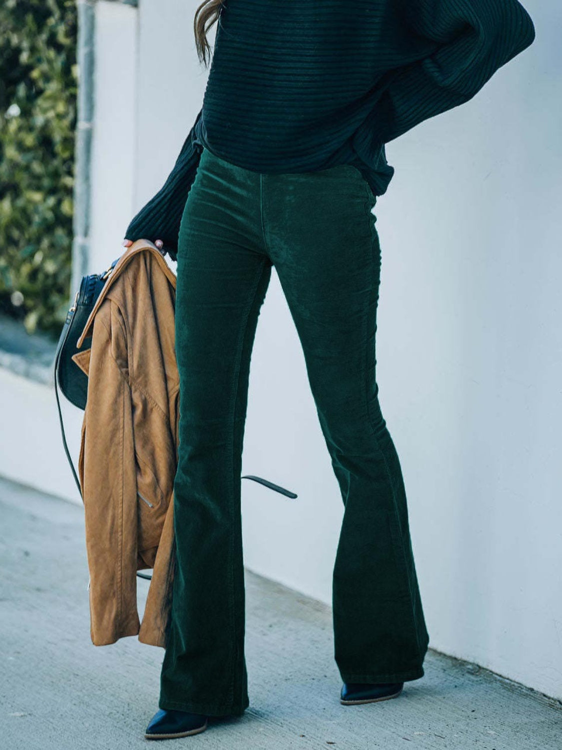 High waist bootcut pants, opaque.