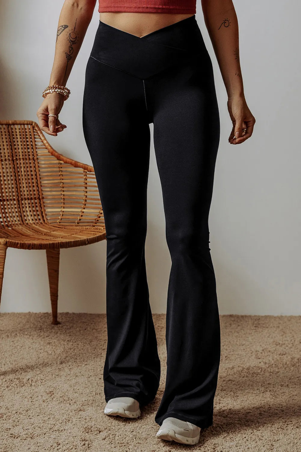 High waist bootcut pants, opaque.