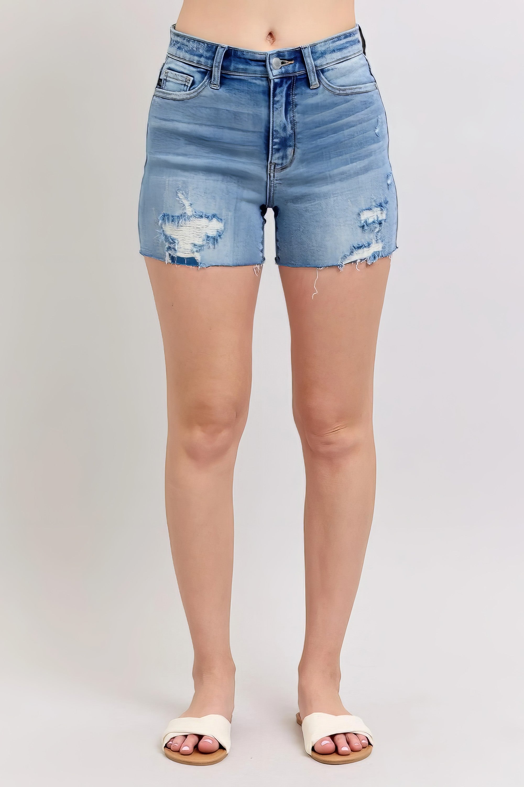 Plus size high-waist denim shorts with stitch over destroy detail and pockets.