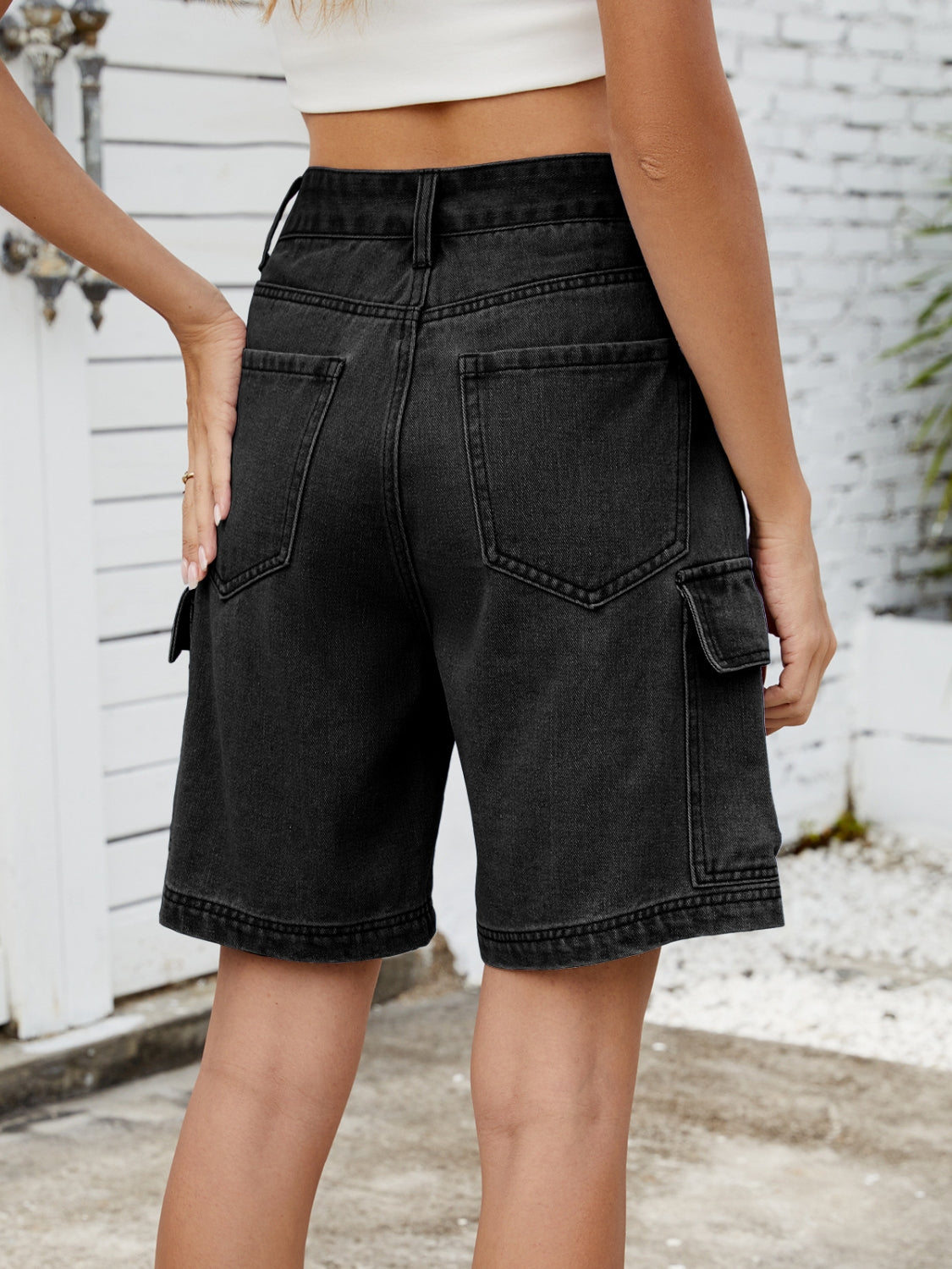 High-waist denim shorts with cargo pockets.