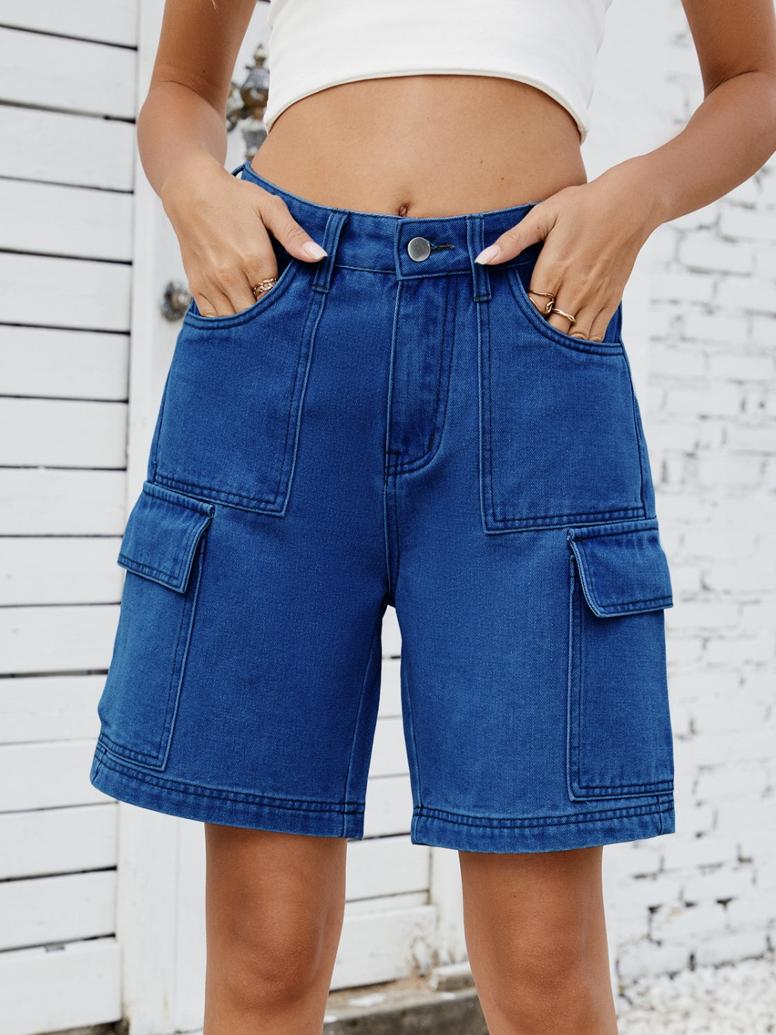 High-waist denim shorts with cargo pockets.