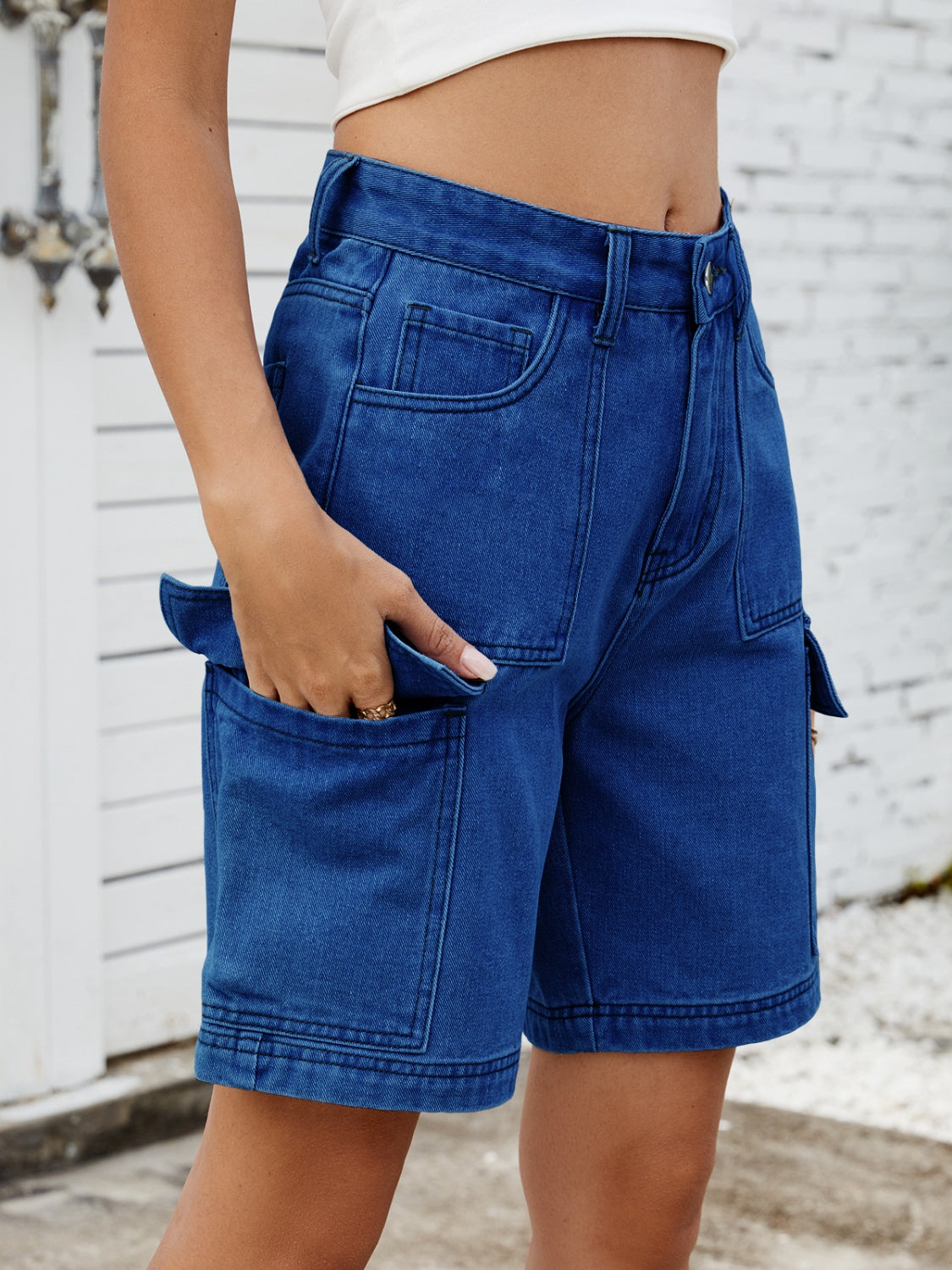 High-waist denim shorts with cargo pockets.